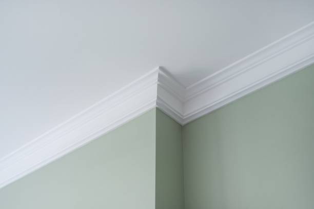 Ceiling moldings in the interior, a detail of intricate corner.